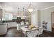 Charming kitchen with an island, bar seating, stainless appliances, and sliding glass doors at 16690 Amberstone Way, Parker, CO 80134