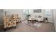 Cozy living room with a comfortable couch, patterned chairs, and a stylish coffee table with rug at 16690 Amberstone Way, Parker, CO 80134