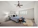 Vaulted ceiling Primary bedroom with ceiling fan, bright windows, and comfortable carpet at 16690 Amberstone Way, Parker, CO 80134