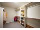 Organized walk-in closet with custom shelving and ample storage space at 16690 Amberstone Way, Parker, CO 80134