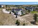Aerial view showcasing the home's exterior and landscaping, and neighborhood views at 8263 Merryvale Trl, Parker, CO 80138