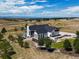 Aerial view of a house with backyard and mountain views at 8263 Merryvale Trl, Parker, CO 80138