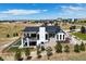 Aerial view of a two story home, landscaped yard, and surrounding neighborhood at 8263 Merryvale Trl, Parker, CO 80138