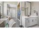 Modern bathroom with double vanity, soaking tub, and shower at 8263 Merryvale Trl, Parker, CO 80138