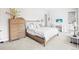 Main bedroom with a wooden bed frame and dresser at 8263 Merryvale Trl, Parker, CO 80138