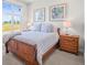 Cozy bedroom with wooden sleigh bed and natural light at 8263 Merryvale Trl, Parker, CO 80138