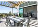 Deck with dining furniture and sliding doors leading to the interior dining area at 8263 Merryvale Trl, Parker, CO 80138