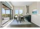 Elegant dining room with large windows, hardwood floors, and a view of the deck at 8263 Merryvale Trl, Parker, CO 80138