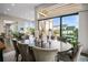 Elegant dining room with a large table and chairs, and sliding doors leading to a deck at 8263 Merryvale Trl, Parker, CO 80138