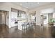 Modern kitchen with white cabinets, island, and stainless steel appliances at 8263 Merryvale Trl, Parker, CO 80138