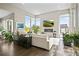 Spacious living room with fireplace and abundant natural light at 8263 Merryvale Trl, Parker, CO 80138