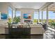 Bright and spacious living room with a fireplace, large windows, and comfortable seating at 8263 Merryvale Trl, Parker, CO 80138