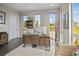 Bright home office with large windows and comfortable seating at 8263 Merryvale Trl, Parker, CO 80138