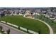 Aerial view of neighborhood with green space and play area for recreation and community engagement at 19000 E 55Th Ave, Denver, CO 80249