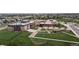 Aerial view of a local school featuring brick accents, garden boxes, and a large grassy area at 19000 E 55Th Ave, Denver, CO 80249