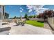 Spacious backyard patio includes outdoor seating, grill, and landscaped areas for relaxation and entertaining at 19000 E 55Th Ave, Denver, CO 80249