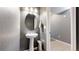 Stylish half bathroom with a modern vanity and tasteful decor, offering convenience and comfort at 19000 E 55Th Ave, Denver, CO 80249