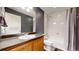 Clean bathroom features a shower-tub combo, vanity, and neutral colors for a fresh, modern look at 19000 E 55Th Ave, Denver, CO 80249