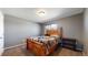 Cozy bedroom with warm carpet, wood furniture, and a comfortable bed for a relaxing retreat at 19000 E 55Th Ave, Denver, CO 80249
