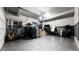Garage with gray walls and filled with belongings creating a versatile space for storage and projects at 19000 E 55Th Ave, Denver, CO 80249