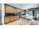 Modern kitchen featuring ample cabinetry, stainless steel appliances, and tile backsplash at 19000 E 55Th Ave, Denver, CO 80249