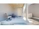 Covered front porch with seating area offering a relaxing spot to enjoy the outdoors at 19000 E 55Th Ave, Denver, CO 80249