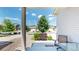 Covered front porch with seating area, and view of the street and neighborhood at 19000 E 55Th Ave, Denver, CO 80249
