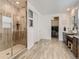 Spa-like bathroom with double vanity, large shower, and ample storage at 8803 S Winnipeg Ct, Aurora, CO 80016