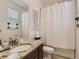 Bathroom with granite countertop, shower/tub combo, and updated fixtures at 8803 S Winnipeg Ct, Aurora, CO 80016