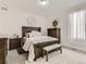 Secondary bedroom with wood furniture and plush carpet at 8803 S Winnipeg Ct, Aurora, CO 80016
