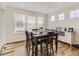 Bright dining area features a table for six and plenty of natural light at 8803 S Winnipeg Ct, Aurora, CO 80016
