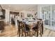 Kitchen dining area with hardwood floors and access to backyard patio at 8803 S Winnipeg Ct, Aurora, CO 80016