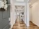 Bright and spacious entryway with hardwood floors and modern decor at 8803 S Winnipeg Ct, Aurora, CO 80016