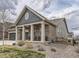 Ranch-style home with gray siding, stone accents, and a covered porch at 8803 S Winnipeg Ct, Aurora, CO 80016