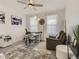 Bright home office features built-in desk, comfortable seating, and large windows at 8803 S Winnipeg Ct, Aurora, CO 80016