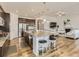 Open concept kitchen features granite island, stainless steel appliances, and hardwood floors at 8803 S Winnipeg Ct, Aurora, CO 80016