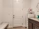 Convenient laundry room with built-in cabinets and storage at 8803 S Winnipeg Ct, Aurora, CO 80016
