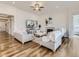 Comfortable living room with hardwood floors, fireplace, and large TV at 8803 S Winnipeg Ct, Aurora, CO 80016