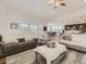 Open living space with hardwood floors, fireplace, and access to kitchen at 8803 S Winnipeg Ct, Aurora, CO 80016