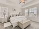 Spacious main bedroom with plush carpet, a ceiling fan, and plenty of natural light at 8803 S Winnipeg Ct, Aurora, CO 80016