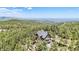 Idyllic aerial view of a charming home tucked away in a serene forest setting with majestic mountain views at 14980 Elk Mountain Trl, Littleton, CO 80127