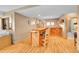 Basement bar with custom wood bar, seating, custom lighting, and adjacent bathroom at 14980 Elk Mountain Trl, Littleton, CO 80127