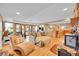 Finished basement featuring a bar area, wood burning fireplace and walkout access to enjoy beautiful views at 14980 Elk Mountain Trl, Littleton, CO 80127