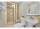 Bathroom featuring a glass shower, pedestal sink, and decorative details at 14980 Elk Mountain Trl, Littleton, CO 80127