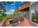 Spacious wooden deck with mountain views, features outdoor cooking with barbecue grill at 14980 Elk Mountain Trl, Littleton, CO 80127