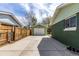 View of a detached garage and long driveway at 2702 Atchison St, Aurora, CO 80011