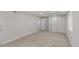 Carpeted basement bedroom with white walls and ample closet space, perfect for guests at 2702 Atchison St, Aurora, CO 80011