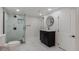 Remodeled bathroom with updated vanity and sink, walk-in shower, and modern fixtures at 2702 Atchison St, Aurora, CO 80011