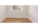 Bright bedroom with hardwood floors and a large window at 2702 Atchison St, Aurora, CO 80011