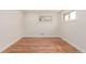 Empty bedroom with hardwood floors and window allowing ample natural light at 2702 Atchison St, Aurora, CO 80011